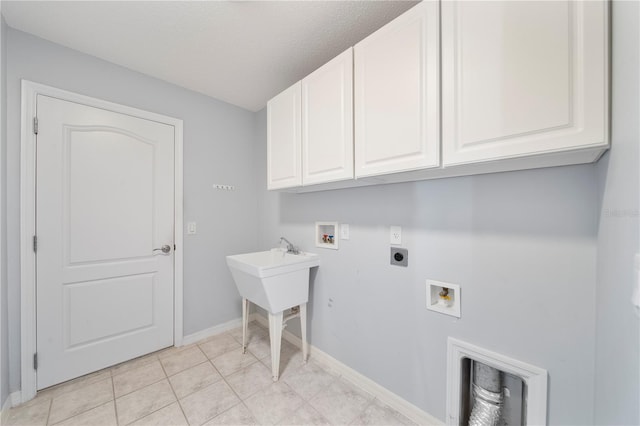 laundry room with cabinets, hookup for a washing machine, light tile patterned floors, a textured ceiling, and hookup for an electric dryer