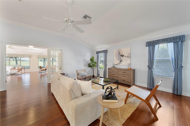 living room featuring dark hardwood / wood-style flooring, vaulted ceiling, ceiling fan, and ornamental molding