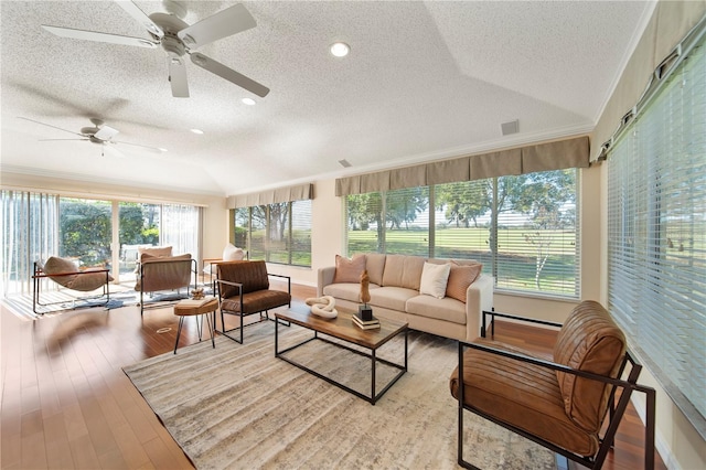 sunroom with vaulted ceiling and ceiling fan