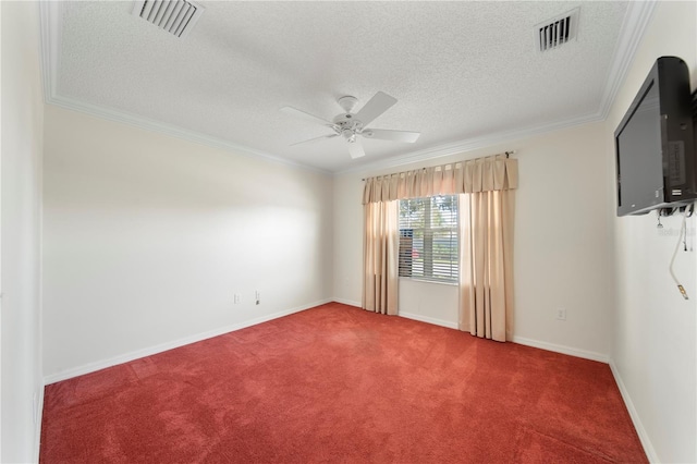 carpeted empty room featuring a textured ceiling, ceiling fan, and crown molding