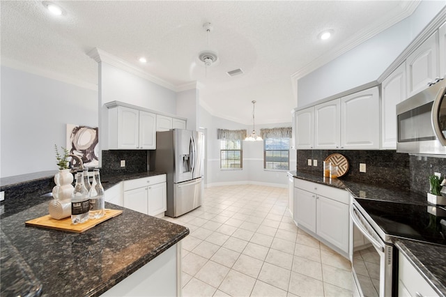 kitchen featuring hanging light fixtures, ornamental molding, stainless steel appliances, and white cabinets