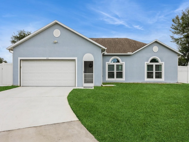 single story home with a garage and a front yard