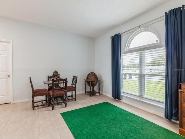 sitting room featuring tile patterned flooring