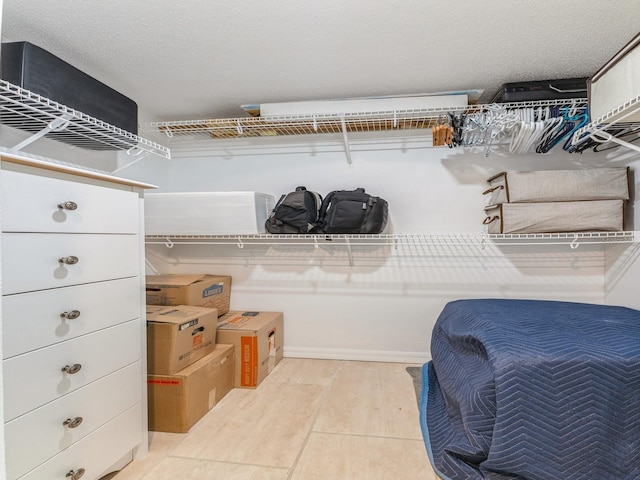 walk in closet featuring light hardwood / wood-style flooring