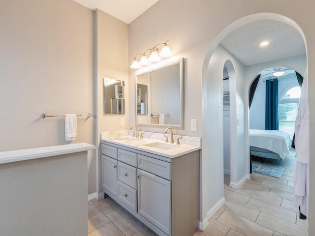 bathroom featuring a textured ceiling and vanity