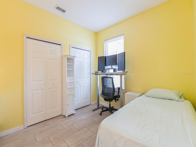 bedroom with multiple closets