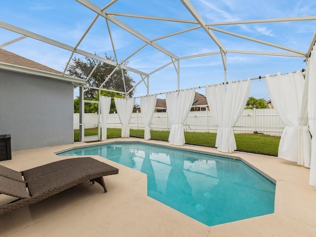 view of pool with a lanai and a patio