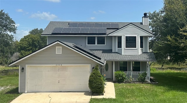 traditional home featuring roof mounted solar panels, a porch, concrete driveway, and a front yard