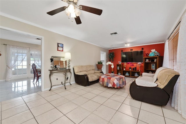 living room with crown molding, ceiling fan, and light tile patterned floors