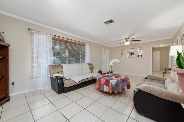 living room with ceiling fan, ornamental molding, and light tile patterned flooring