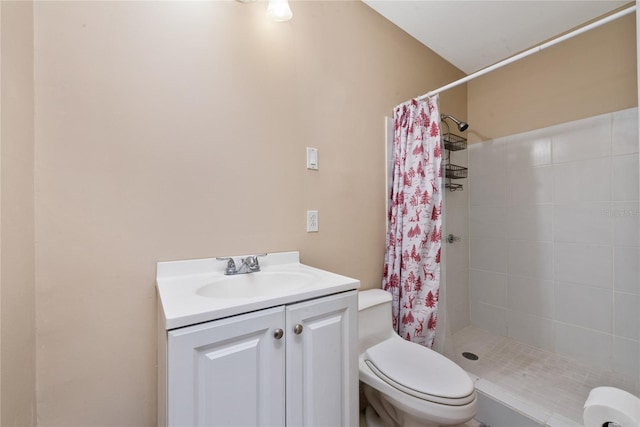 bathroom featuring walk in shower, toilet, and vanity