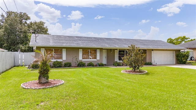 single story home featuring a garage and a front yard