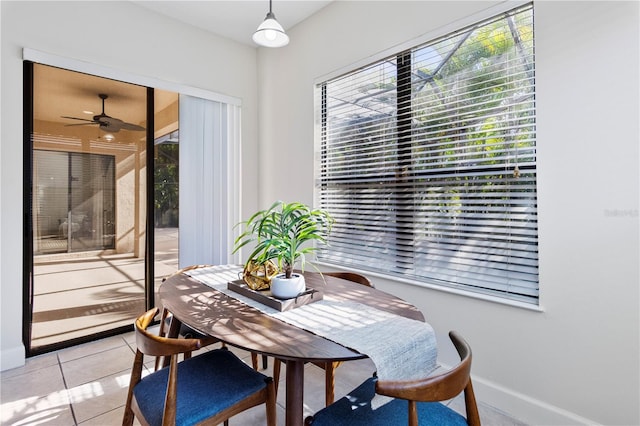 dining area featuring ceiling fan and light tile patterned flooring