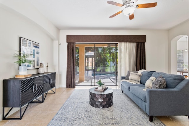 living room featuring ceiling fan and light tile patterned flooring