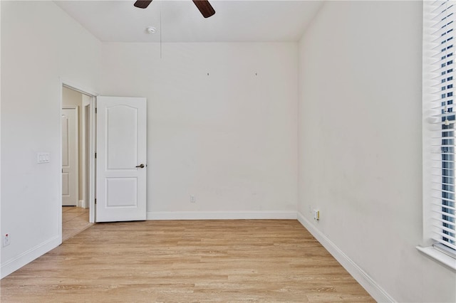 spare room featuring light wood-type flooring and ceiling fan