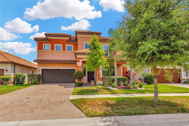 mediterranean / spanish-style house featuring a garage