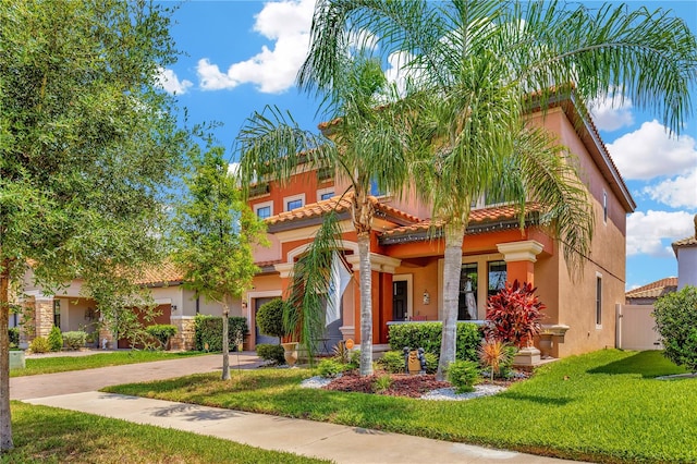 mediterranean / spanish-style house with a front lawn