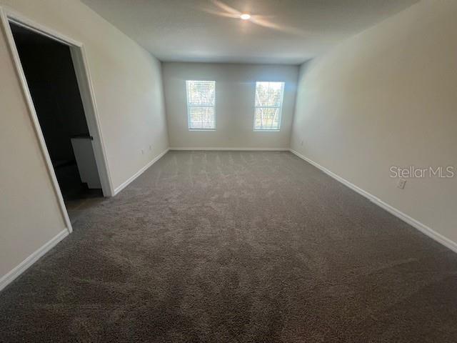 spare room featuring carpet floors