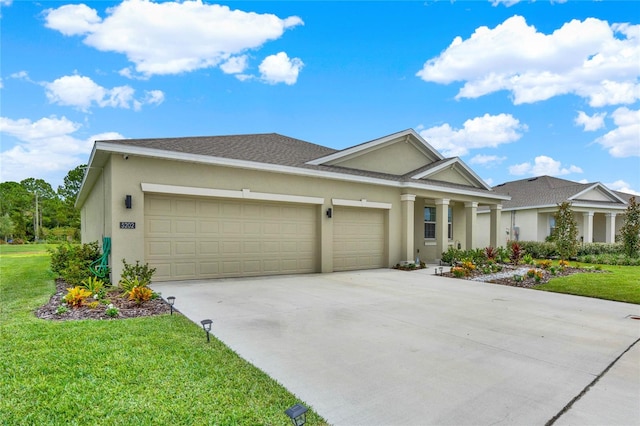 view of front facade featuring a front yard and a garage