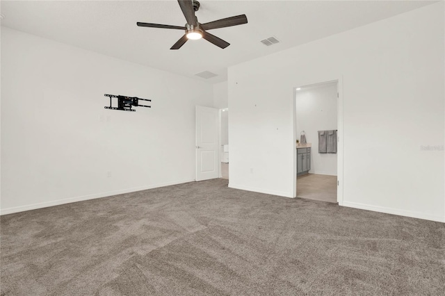 spare room with light carpet and ceiling fan