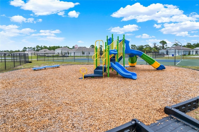 view of play area featuring tennis court