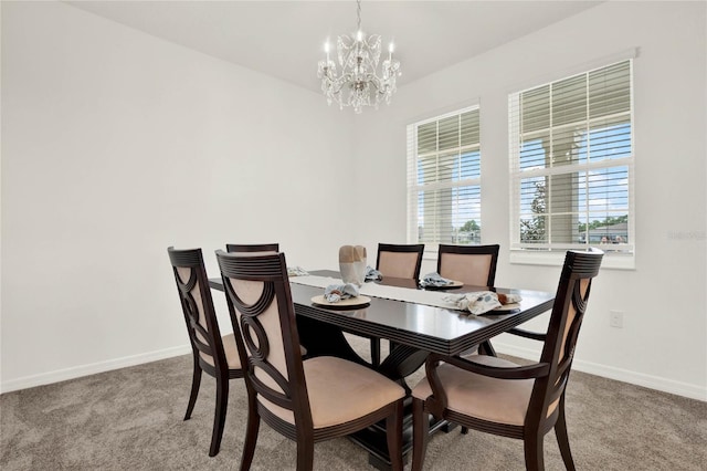 carpeted dining space with a notable chandelier