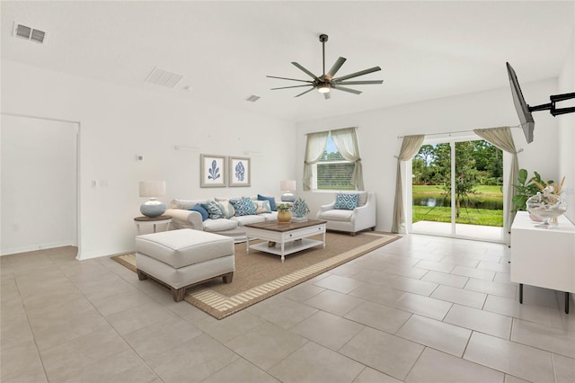 tiled living room featuring ceiling fan