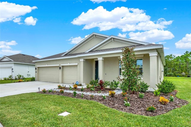 view of front of home with an attached garage, concrete driveway, a front yard, and stucco siding