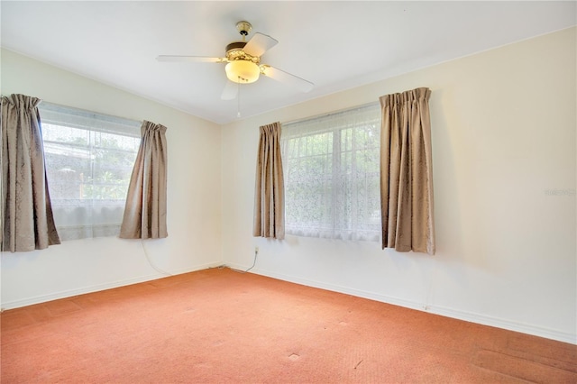 spare room with carpet and ceiling fan