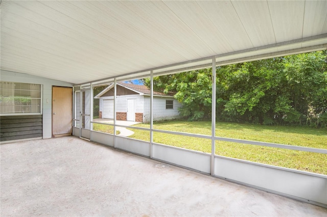 unfurnished sunroom with vaulted ceiling