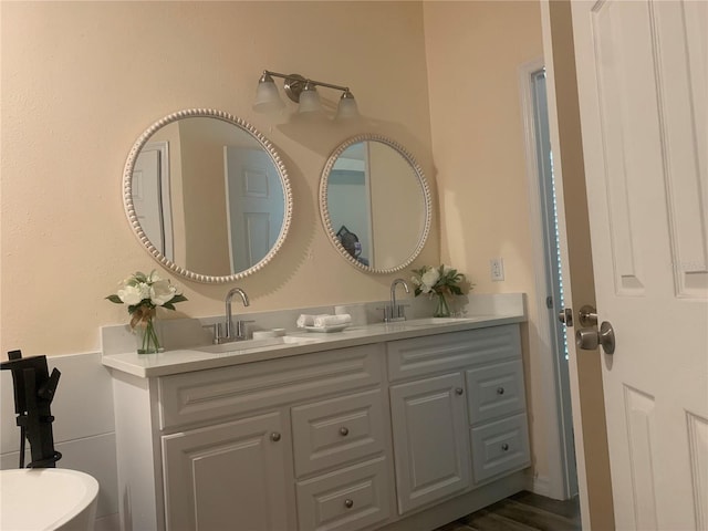 bathroom featuring hardwood / wood-style flooring and vanity