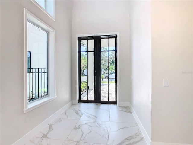 entryway with a wealth of natural light and french doors