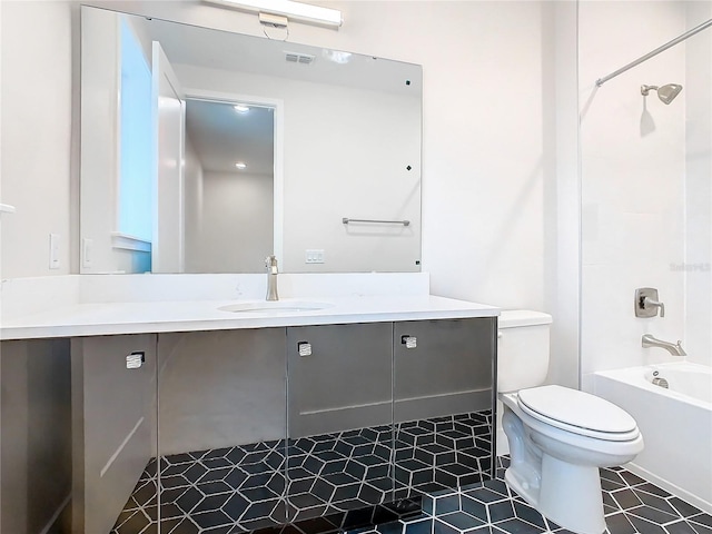 full bathroom with vanity, shower / bath combination, tile patterned flooring, and toilet