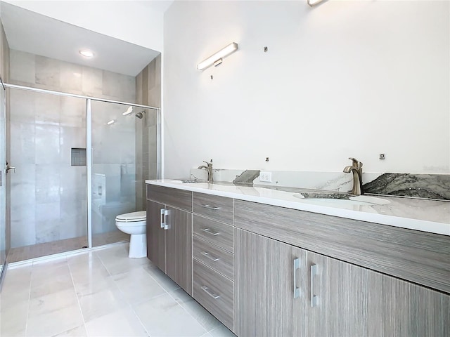 bathroom with vanity, tile patterned flooring, toilet, and a shower with shower door