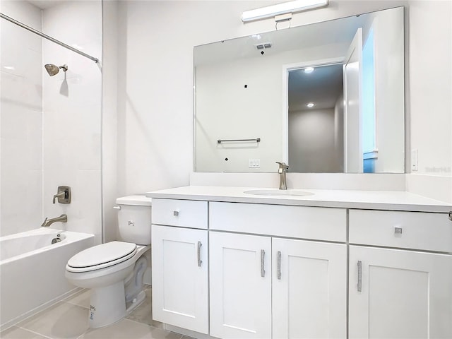 full bathroom featuring vanity, tiled shower / bath combo, toilet, and tile patterned floors