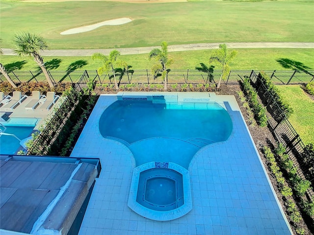 view of pool with an in ground hot tub and a patio area