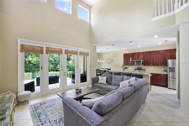 tiled living room with a high ceiling