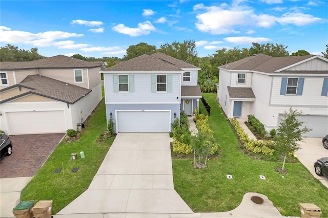 view of front of property featuring a front lawn and a garage