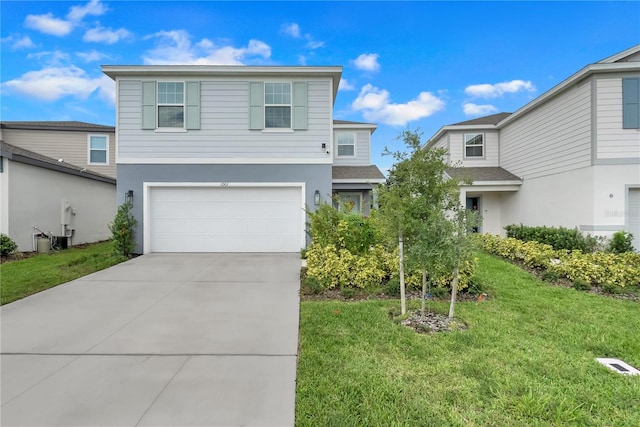 view of front property with a garage and a front lawn