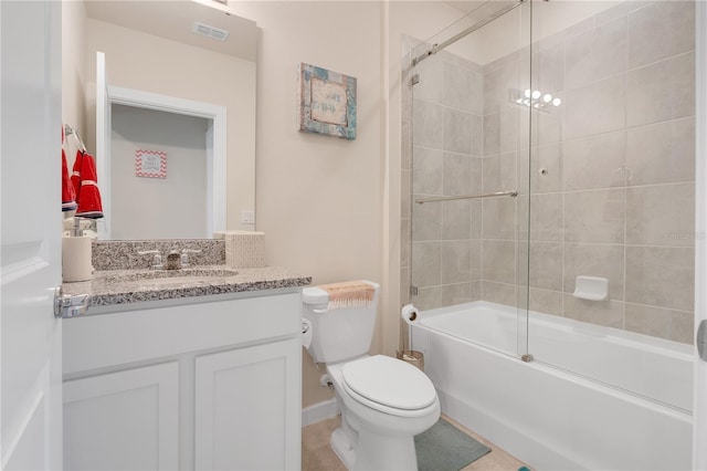 full bathroom featuring shower / bath combination with glass door, vanity, and toilet