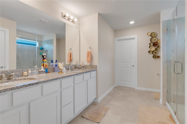 bathroom with vanity and walk in shower