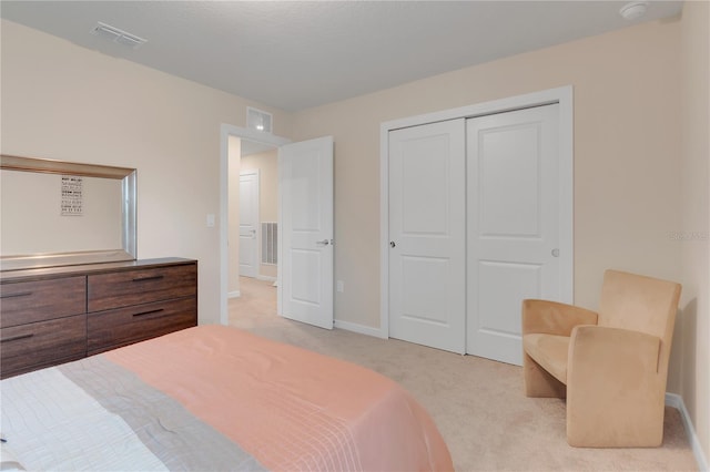 carpeted bedroom with a closet