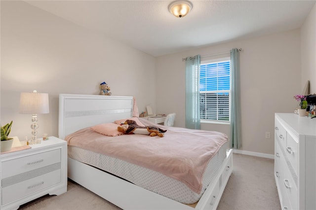 bedroom with light colored carpet