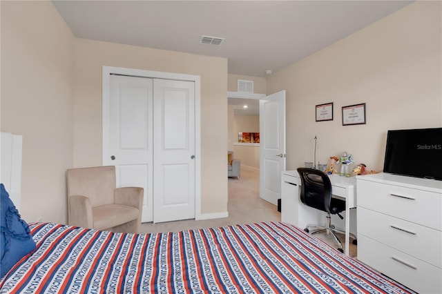 carpeted bedroom with a closet