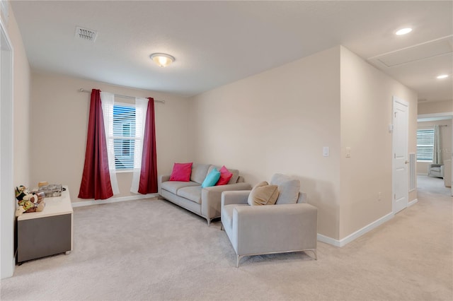 living room featuring light carpet