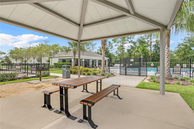 view of community with a gazebo, a pool, and a patio