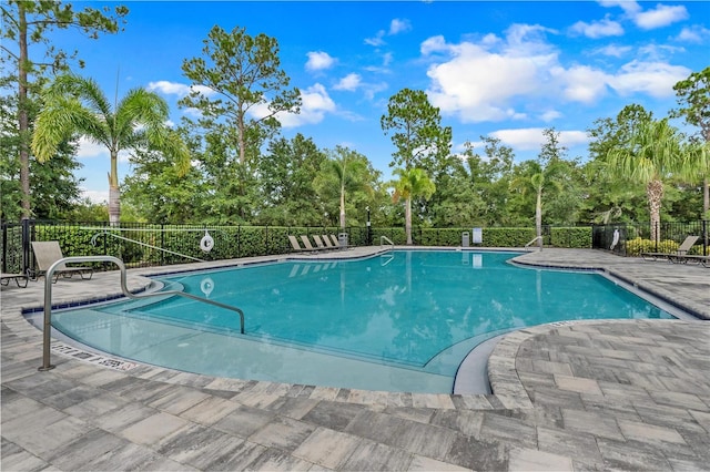 view of swimming pool featuring a patio