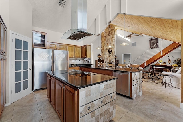 kitchen featuring island range hood, a kitchen island, and high vaulted ceiling