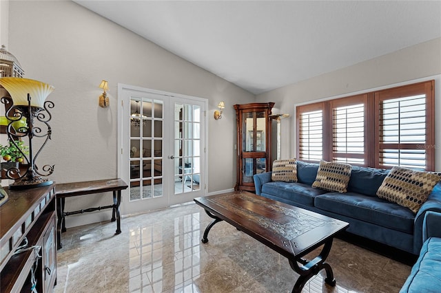 living room with french doors and vaulted ceiling