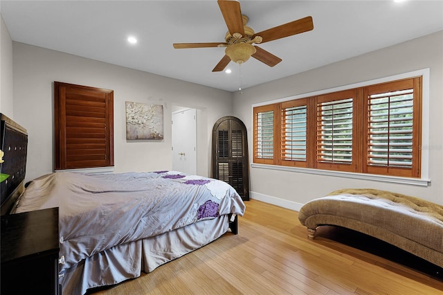 bedroom featuring light wood-type flooring and ceiling fan